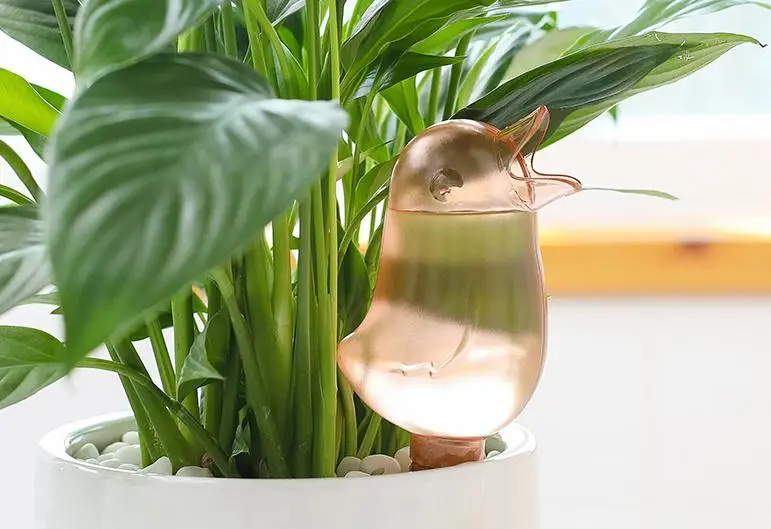 
2021 new transparent automatic dripper gardening household automatic watering bird shape lazy watering flower pot product description