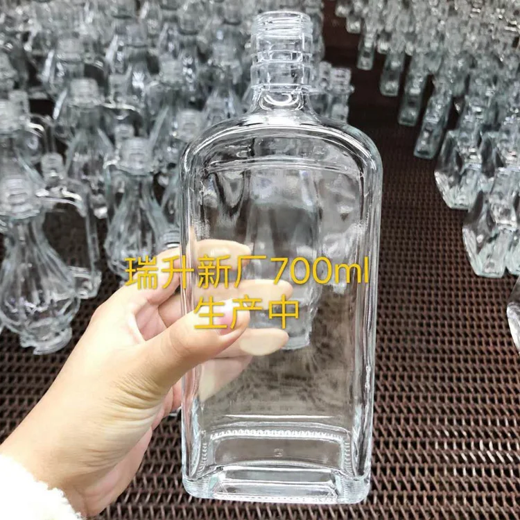 750ml 700ml emboss glass liquor bottle price empty whisky bottle customized bottles for whisky and vodka