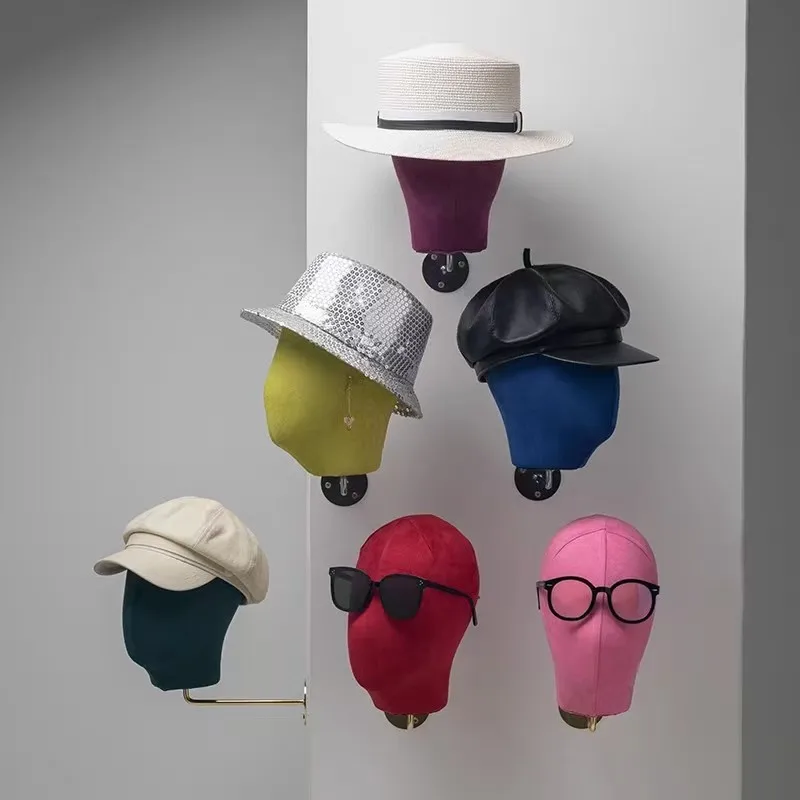 High-end stand for clothing store display such as fabric-covered heads with pins for inserting hats, hairbands, and glasses.