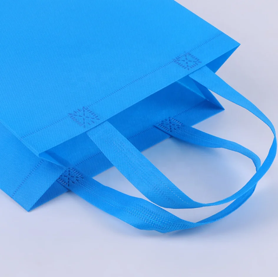wholesale ready to ship cheap factory price reusable colorful ultrasonic non-woven handle bags for shopping