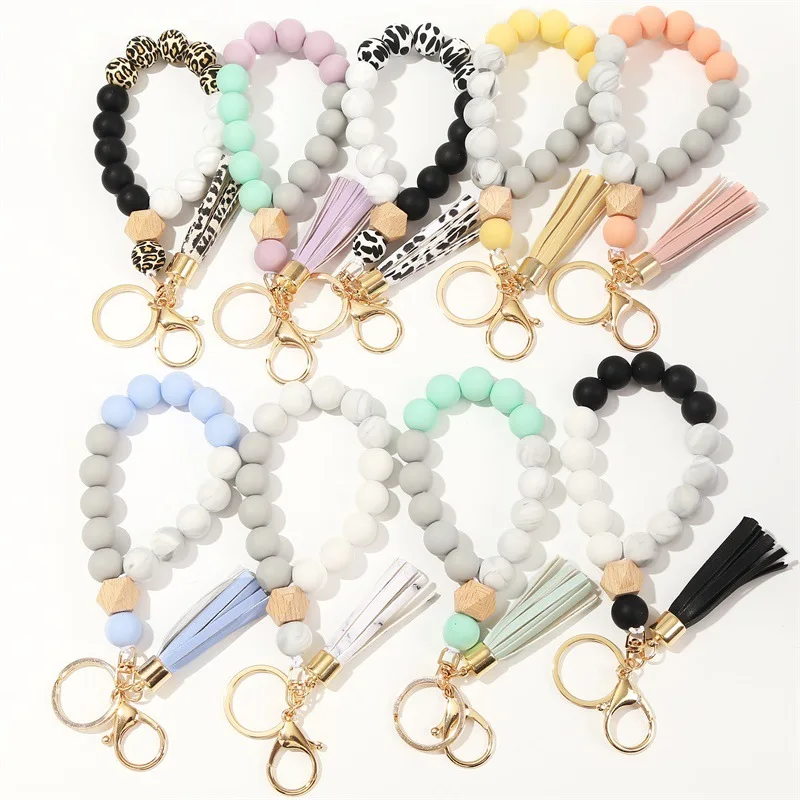 2023 Wholesale New Food Grade Silicone Beads Keychain Bracelet Wooden Bead Key Ring Wristlet With PU Tassel
