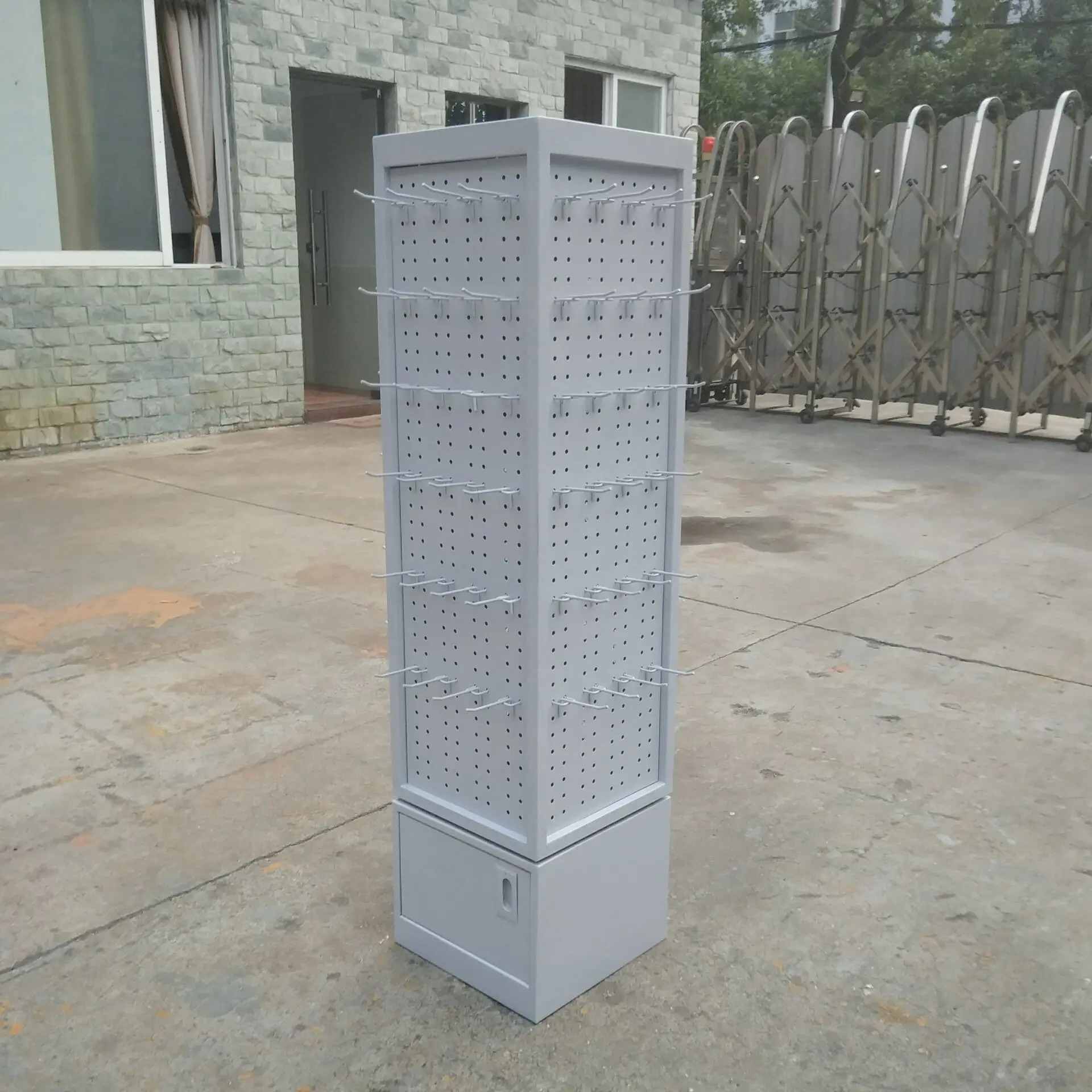 Retail store floor rotating metal pegboard display stand racks for boutique accessories shop boutique display shelf