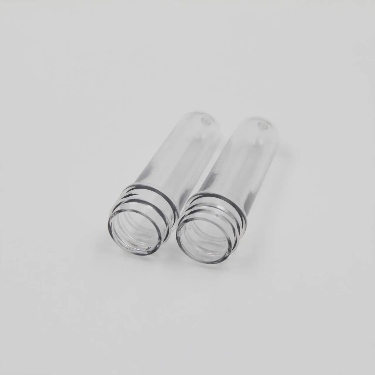 Manufacturer Good Price PET 28mm Pco 1810 14g 25g 45g Plastic Preform Long Neck for Water Juice Bottle Blowing Molding Machine