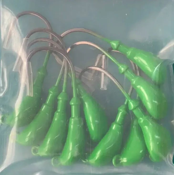 Wholesale fishing lures banana jigs head mustad hooks for sale