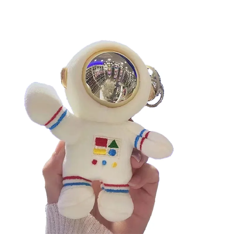 Amazon sells  Fashion Cute Cartoon Cosmonaut Doll Astronaut Pompom Plush Key Chain Key Ring For Gift