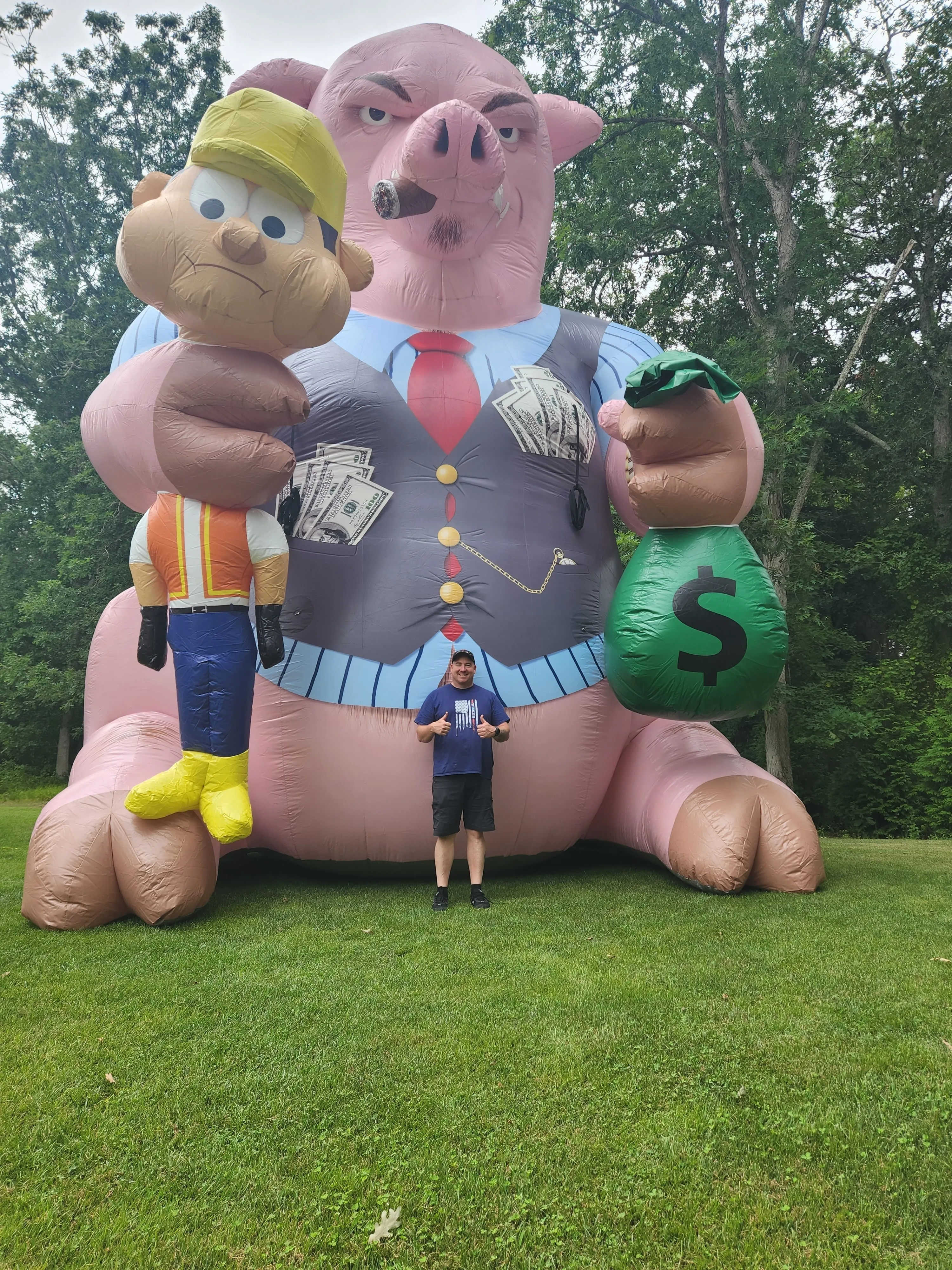 Giant Inflatable cat with construction worker and money bag in hands Inflatable Fat Cat Chokes Union Workers