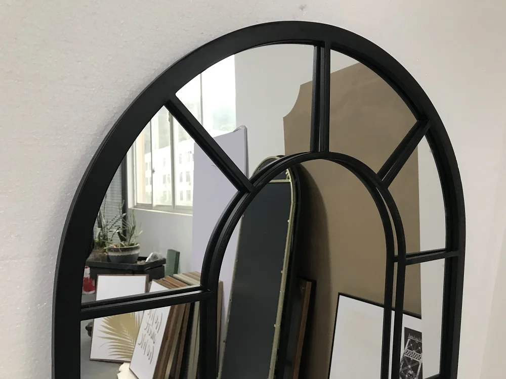 large arched full-length metal floor standing dressing mirror