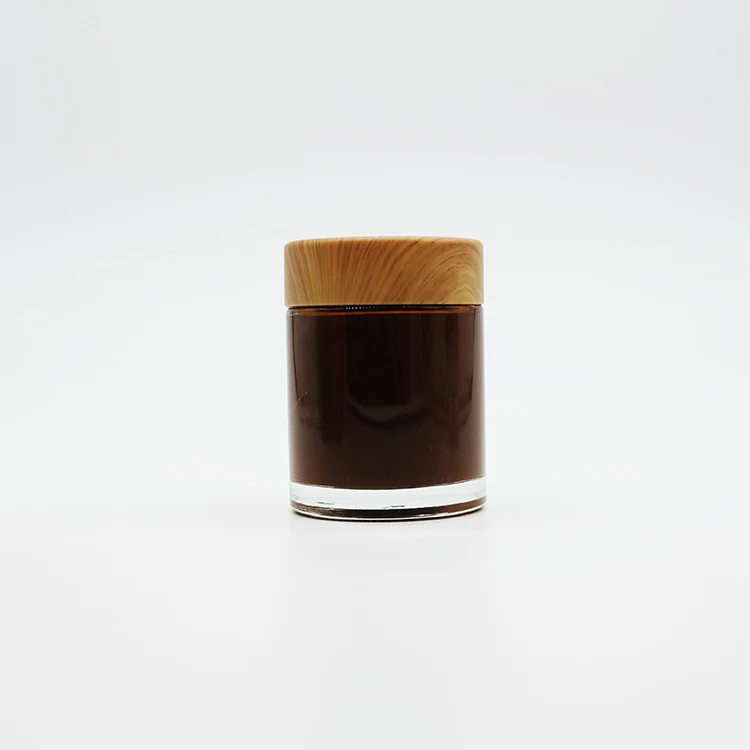 High-End Cylinder Straight Plastic Cap No Leak Heavy Duty Glass Bottle 750ML Clear Glass Jar Bottle With Wood Grain Lid