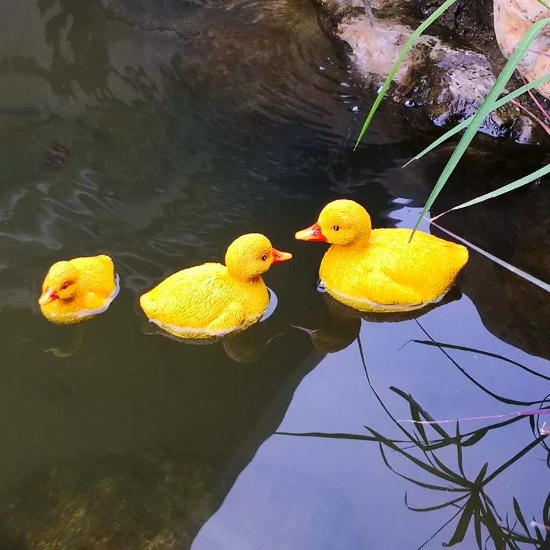 Wholesale resin figure floating pond decoration Resin Little Yellow Duck Sculpture Manufacturer Figurine Outdoor Ornaments