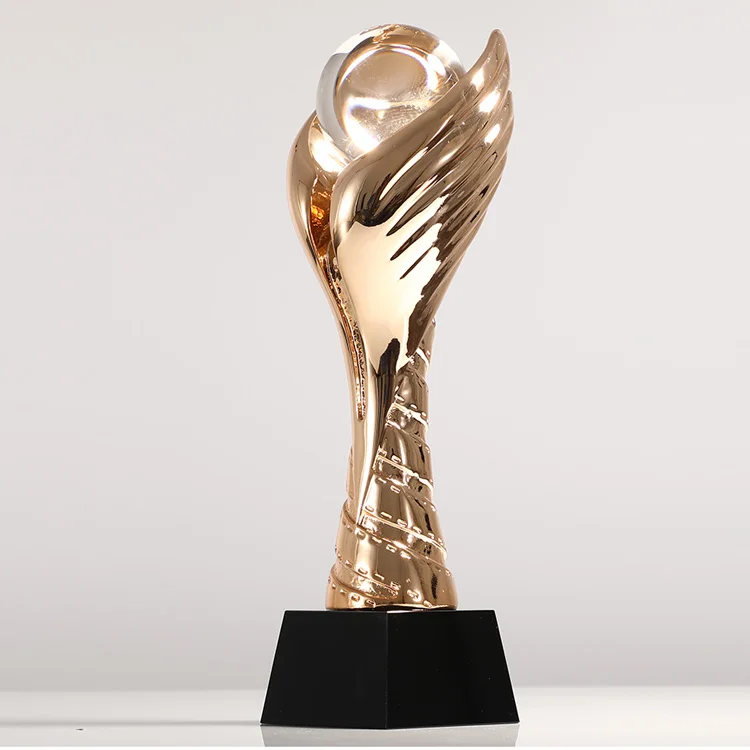 Gold, silver and copper resin trophy customized football and basketball competition group award making flying wings games