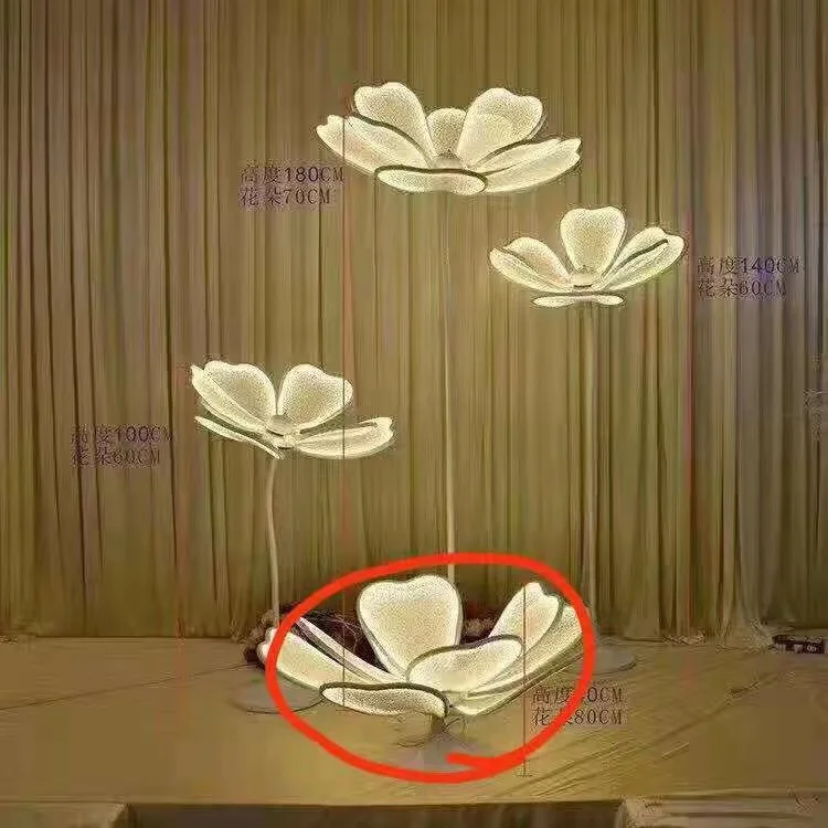 The wedding party is decorated with large flowers and lanterns