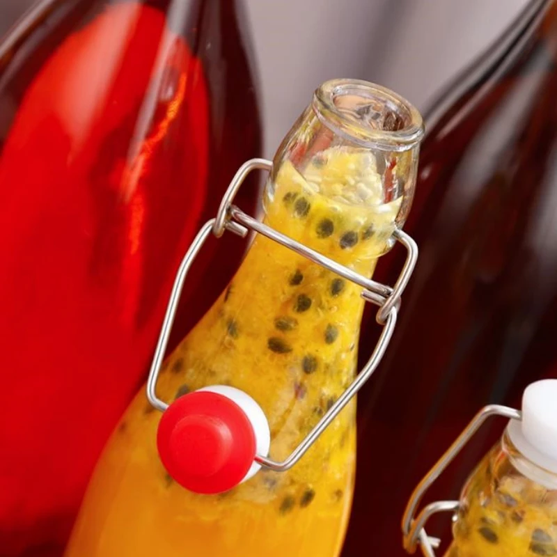 Wholesale Clasp Beverage bottle Clear Juice Drink Sealed Bottle With Lids Glass Bottle Drinking Container