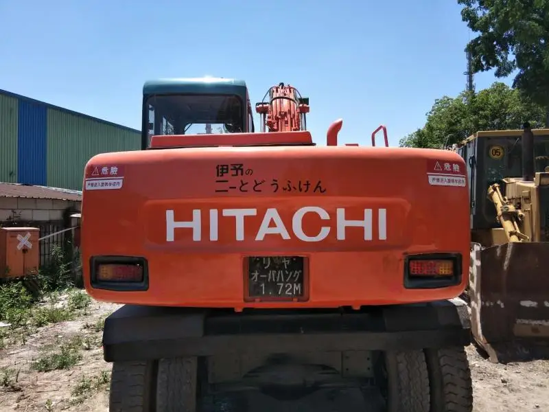 Японский колесный экскаватор HITA CHI EX100WD