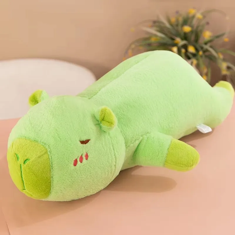 The capybara pulls the pillow for girls to sleep on the bed and holds the sleeping doll long pillow plush toy