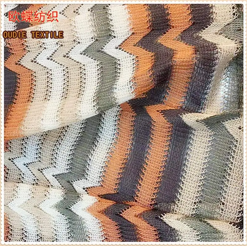 The manufacturer directly provides polyester yarn dyed blended polyester bright silk mesh knitted clothing fabric