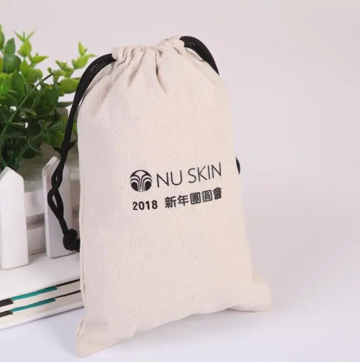 
black color cotton muslin drawstring bag with white logo 