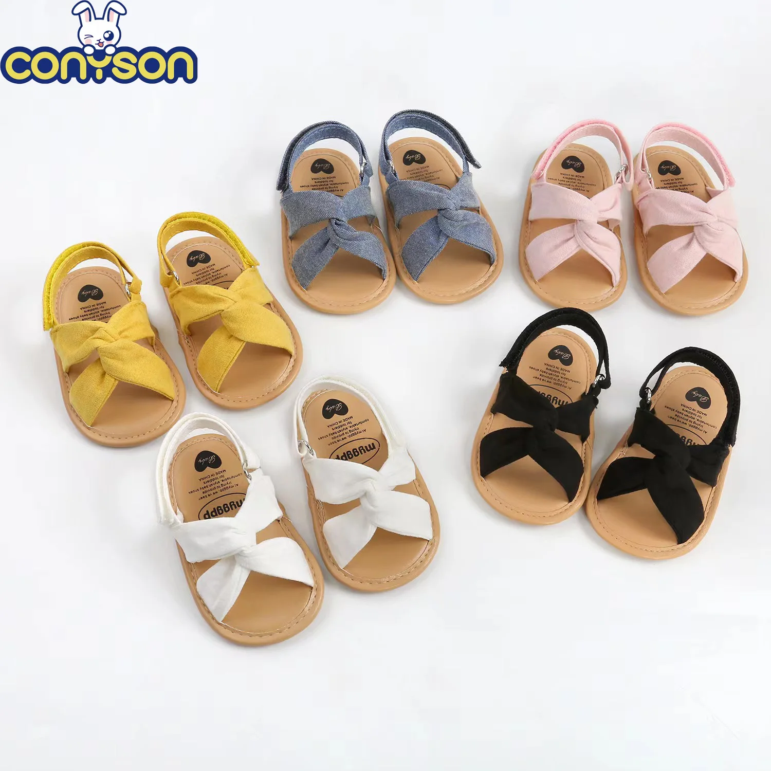 Conyson New Arrival Summer Hook & Loop Fashion Cross Design New Born Baby Girl Sandal Breathable Cotton First Walking Shoes