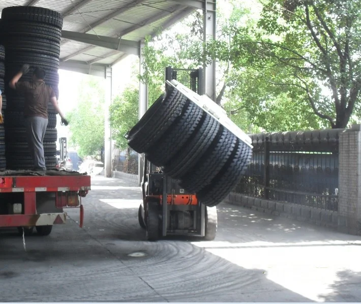 Durable tire clamps forklift attachment used in handling tire