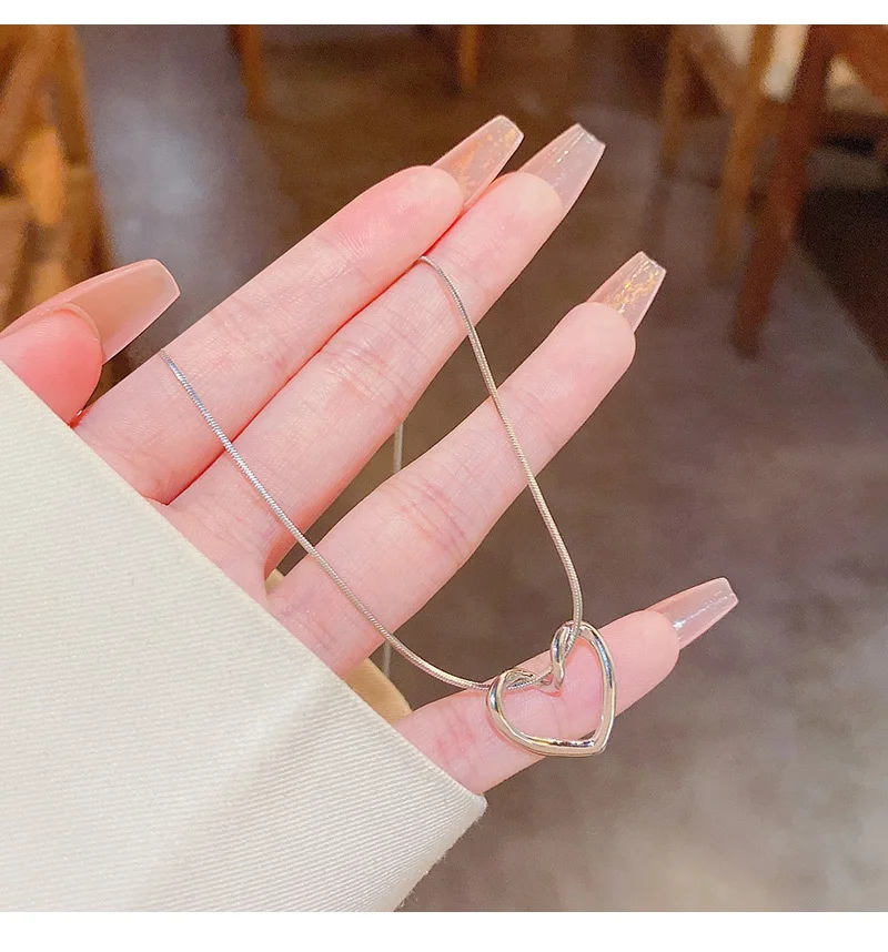 2022 Chic Design Silver Hollow Heart Pendant Necklace Snake Chain Titanium Steel Light Luxury Niche Design Heart Necklace For Gi