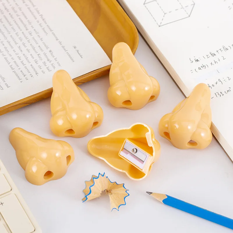 Novelty shape single hole plastic funny nose pencil sharpener for school