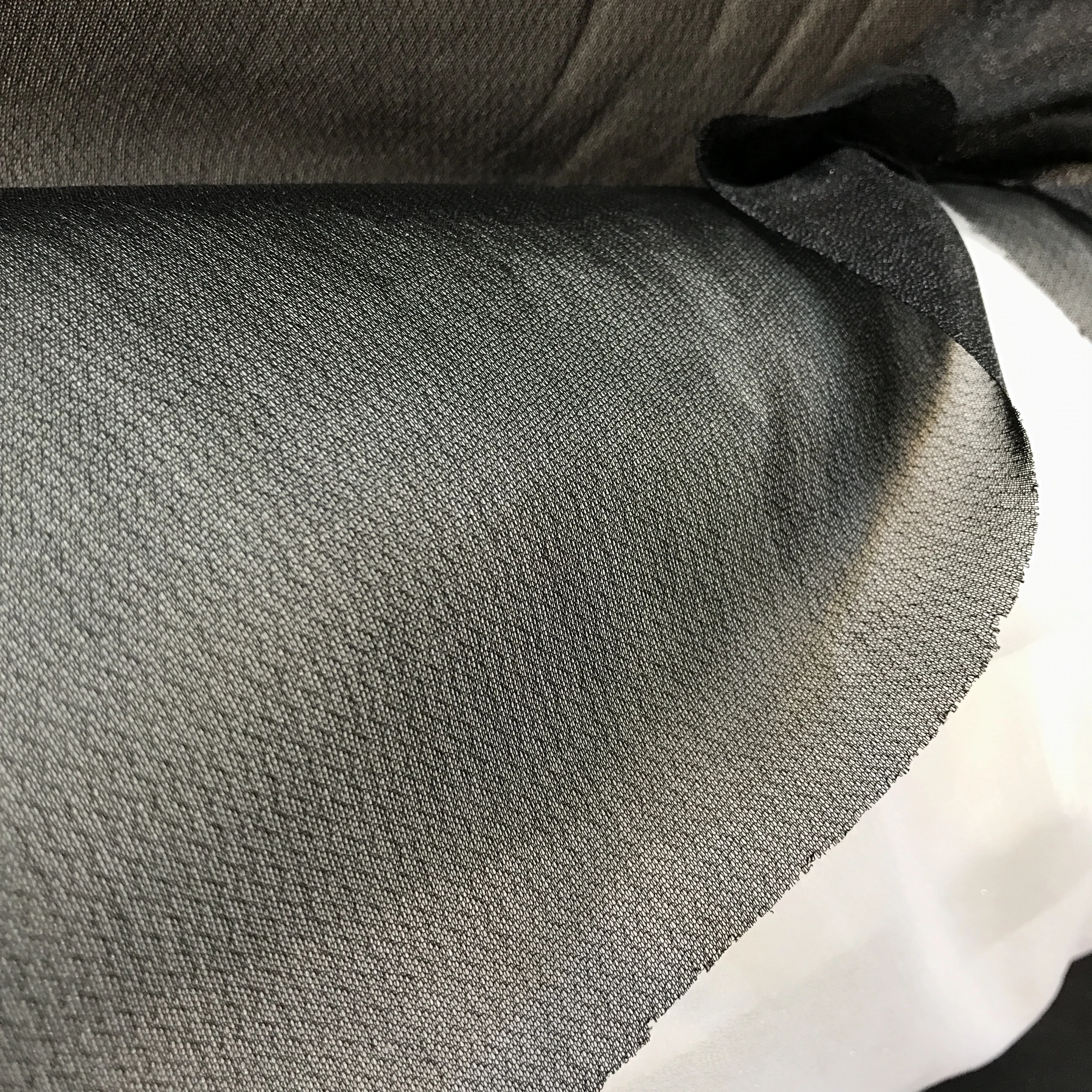 Circular elastic fusible knitted interlining fabric for garment backing