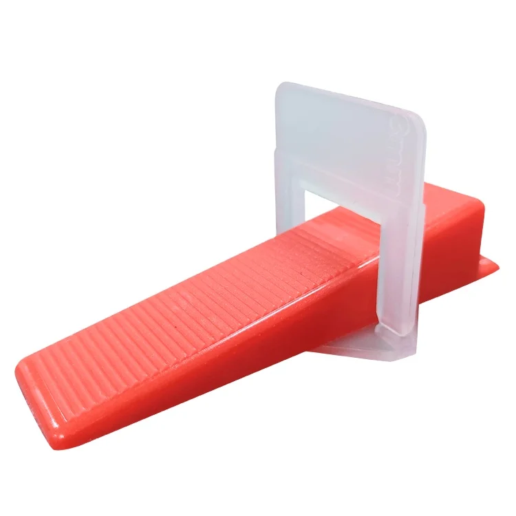 Red plastic leveler white base tile spacing system