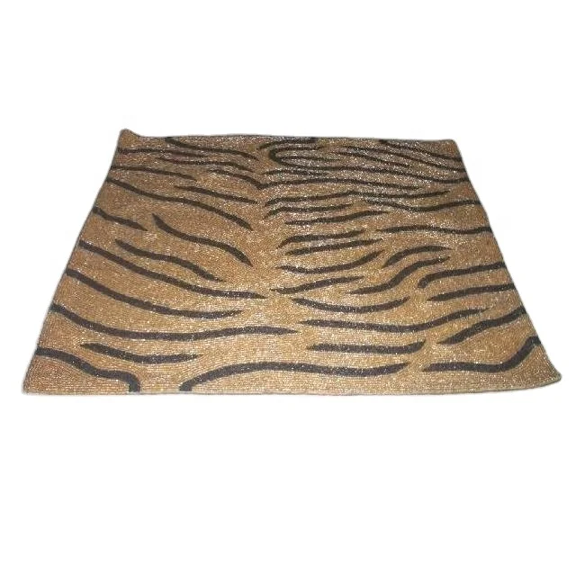 
Glass bead place mats with gold and black patterns other patterns available 