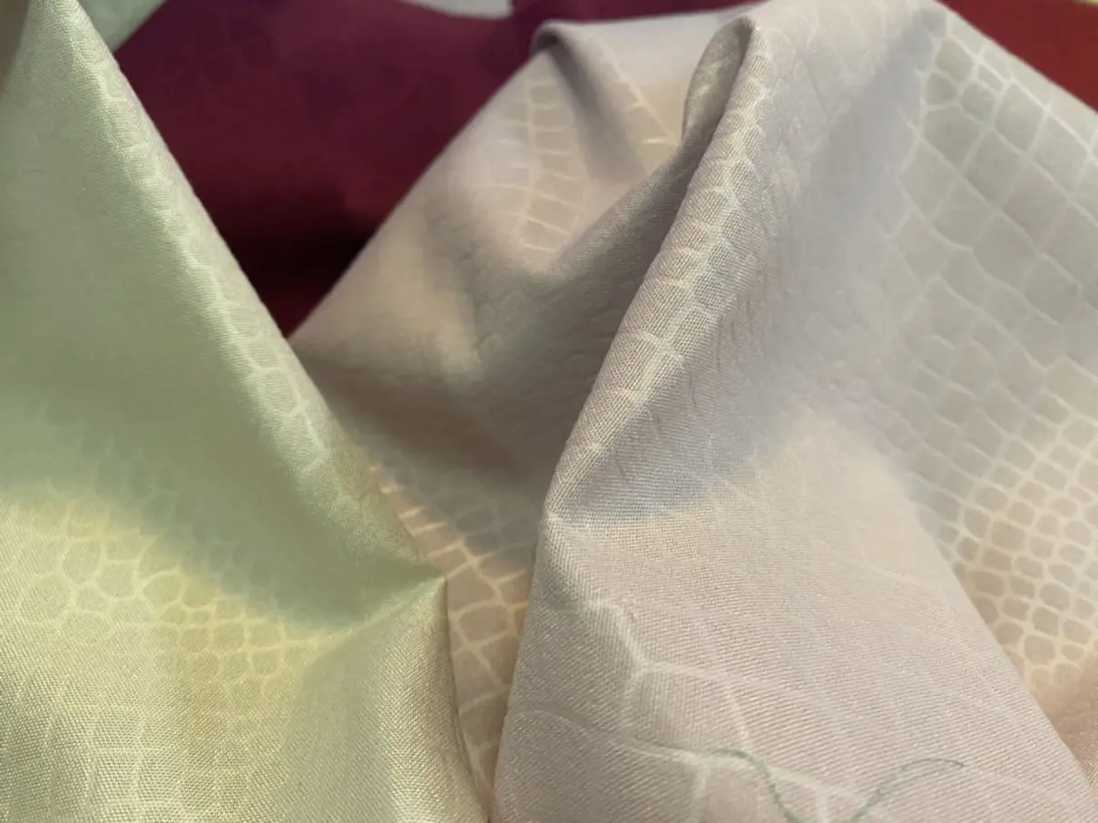 Wholesale 100% polyester stretch knit Dyed Embossed cheap embossed printed fabric for garments