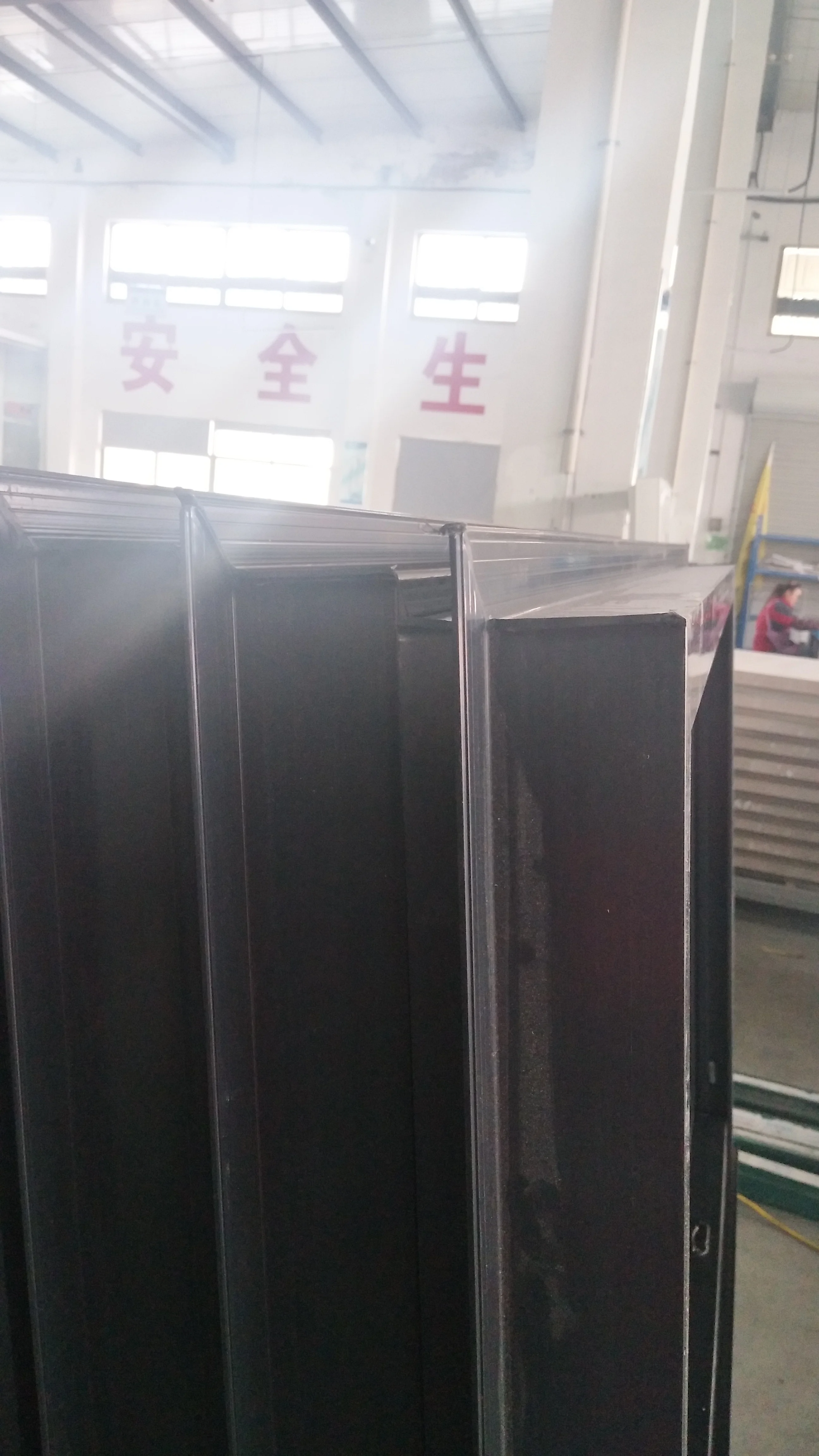 Black vinyl hung window with nail fin girds and  NFRC certification