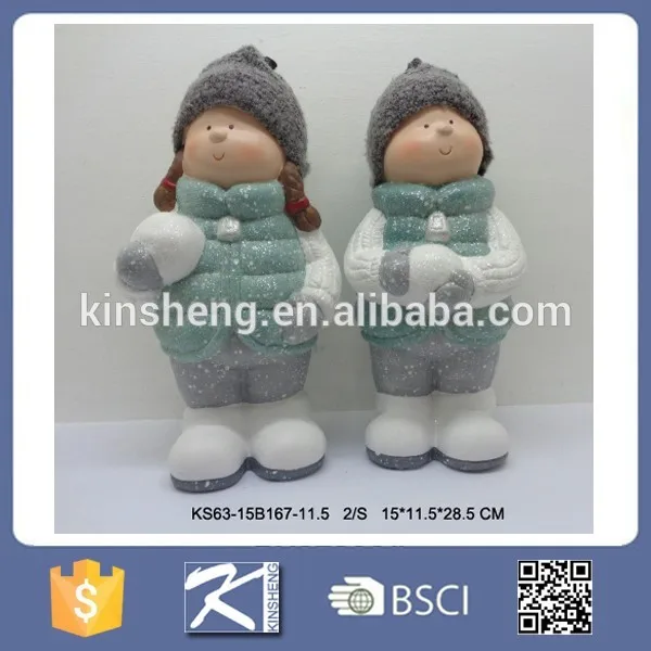 Christmas boy and girl ceramic figurines for sale
