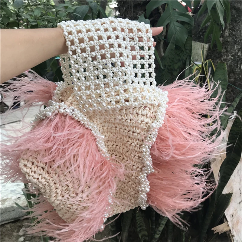 
2020 new vacation style full handmade pink ostrich feather pearl beads clutch bag natural grass weaving bag straw tote bag 