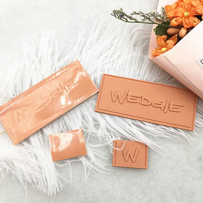 Textured 2D/3D Embossed Garment Rubber Patches High Quality Custom Private Logo Sew On PVC Rubber Labels For Clothing