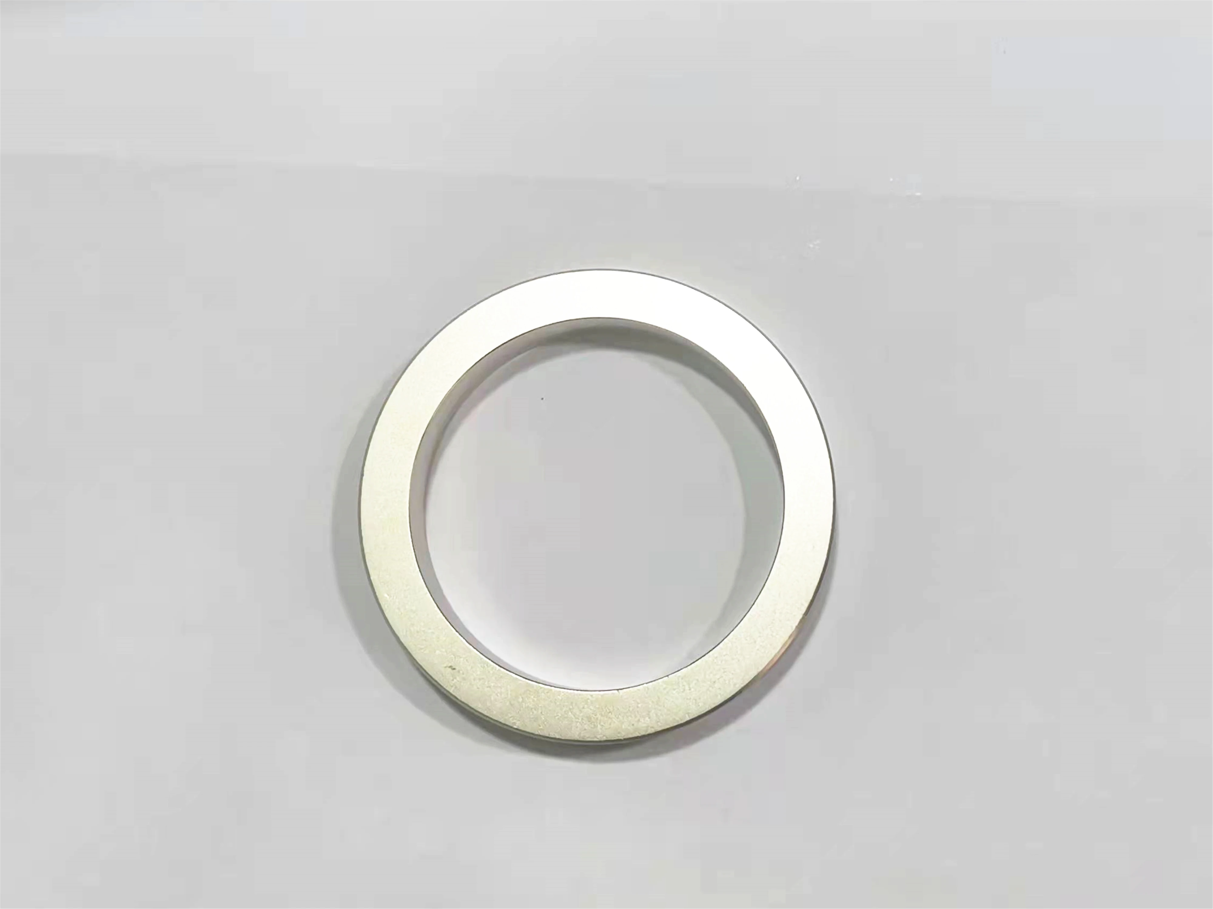 Radially oriented annular sintered neodymium rare earth permanent magnet ring magnet
