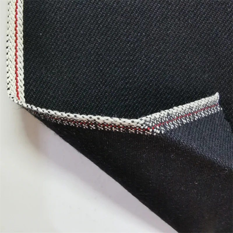Wholesale elastic cotton red selvedge denim fabric in black color