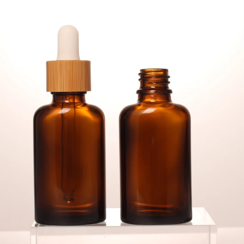 30ml Unique Style Beautiful Amber Color Glass Essential Oil Bottle Custom Printing Bamboo Wooden Dropper Bottle in Stock