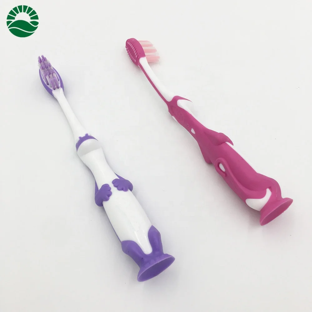 Cute dragon kids personalized toothbrush with suction bottom end round tooth brush