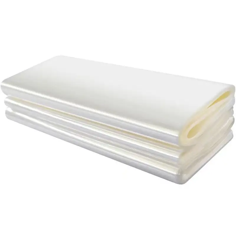 custom clear perforated cosmetic packagingPVC food plastic low temperature shrinkable roll wrap bag pvc heat shrink film