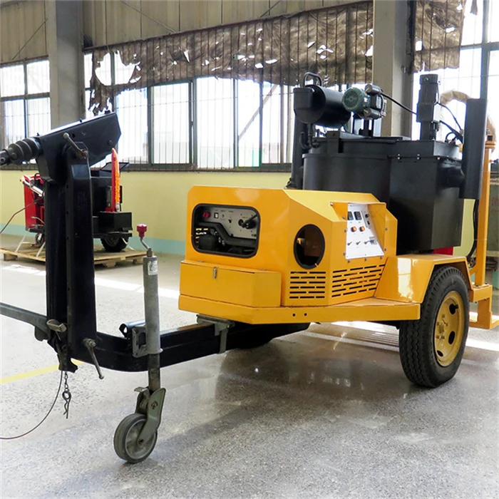 Hot pour sealing machine for asphalt and concrete cracks