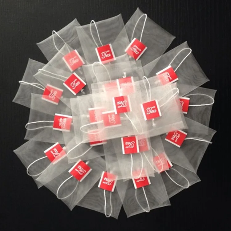 China empty nylon tea bag with string and private label  logo tag for tea packing