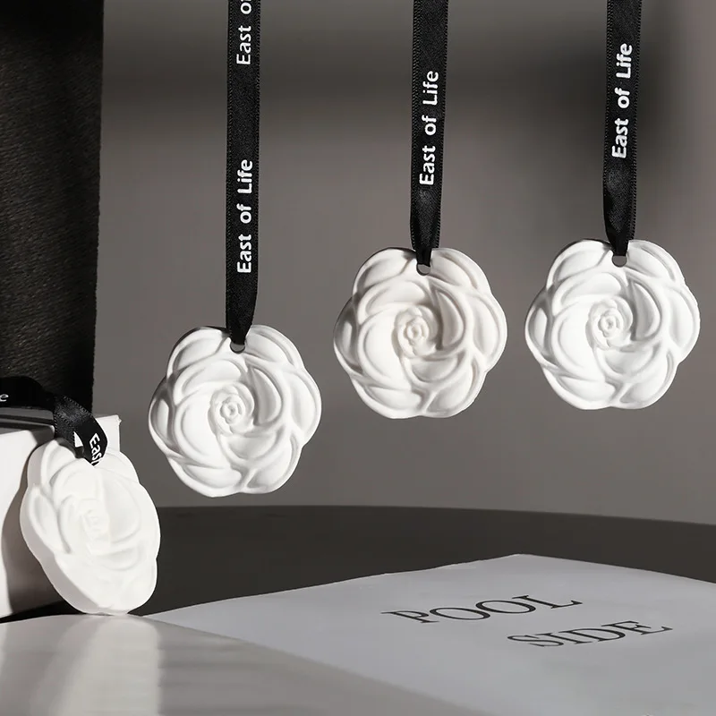 Wholesale camellia car aromatherapy hanging piece home wardrobe aromatherapy wax piece gypsum scented piece air freshener