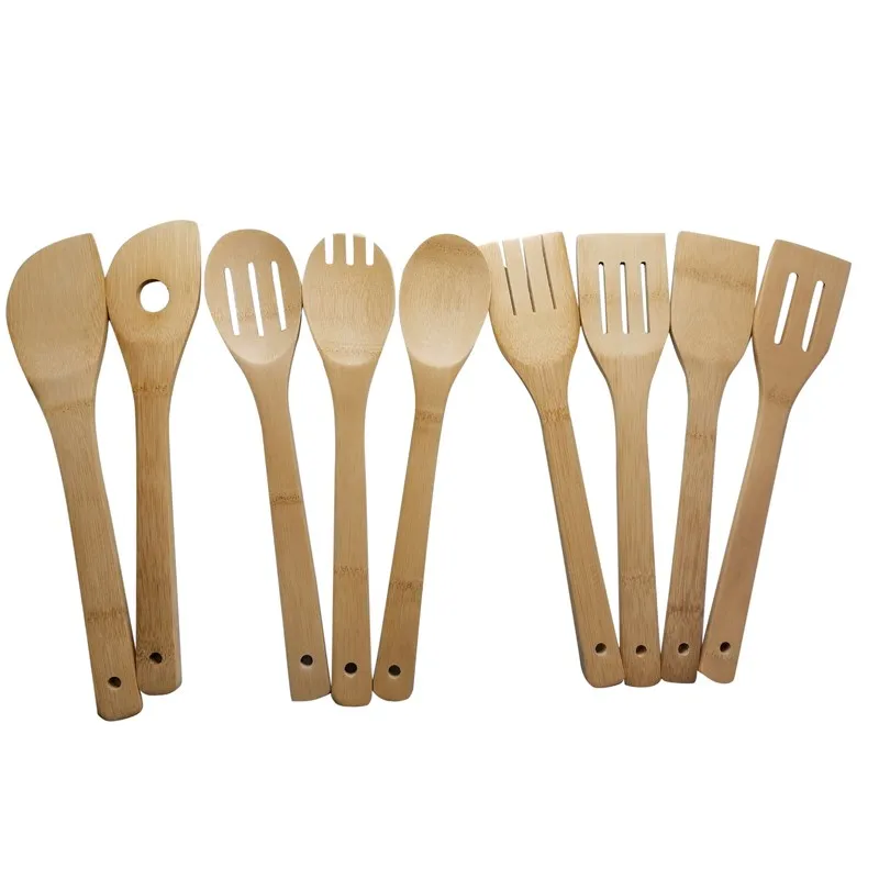 Bamboo spatula in stocked kitchen gadgets for cooking