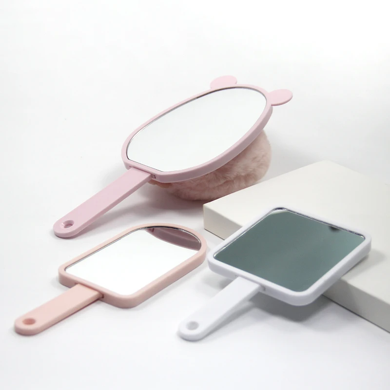 Wholesale square simple hand-held makeup mirror girls carry beauty makeup mirror can be customized LOGO Built-in comb