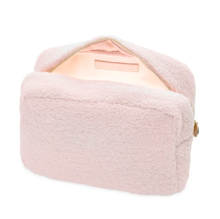 faux shearling pouch featuring a rectangle-shaped body and a zippered top handle