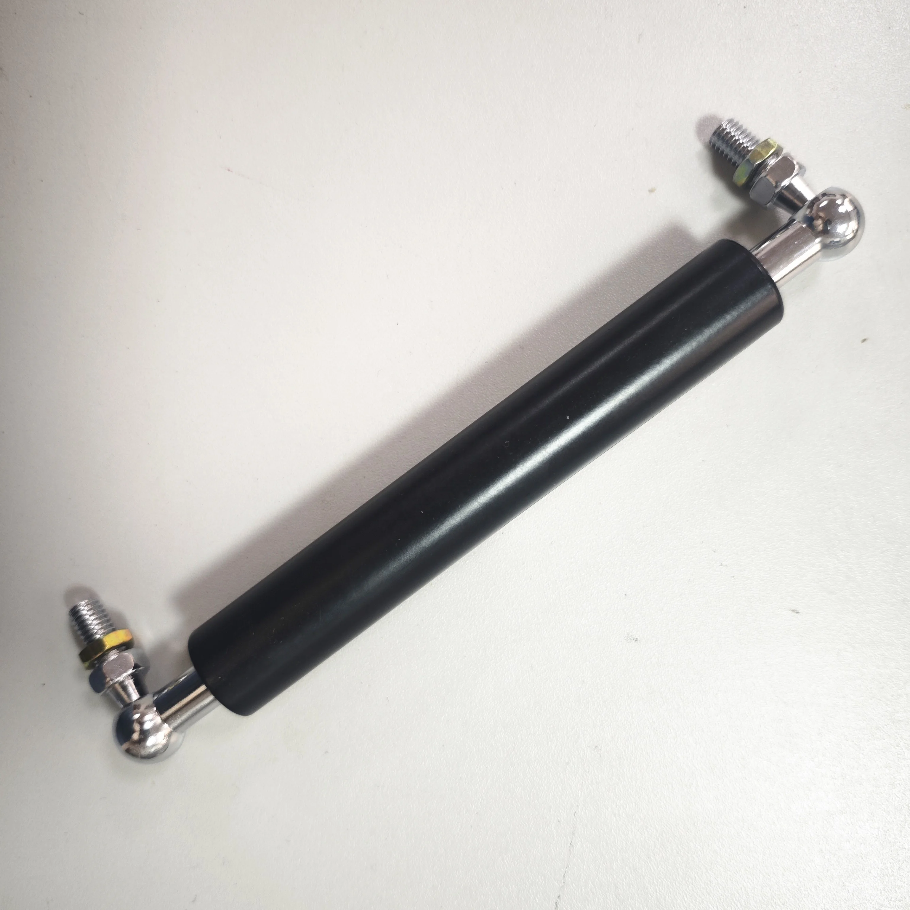 spring-loaded gas spring monitor arm