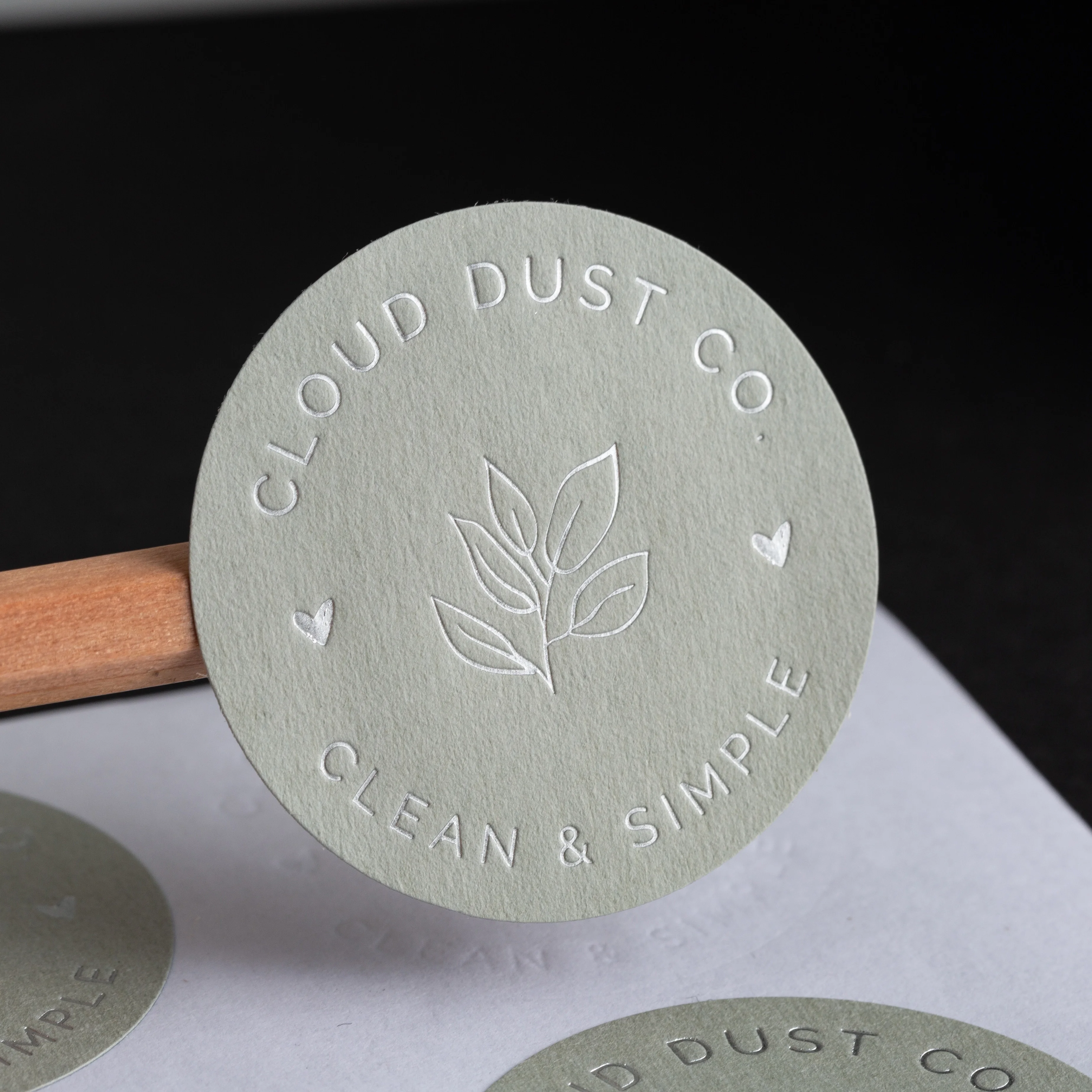 Factory luxury customized gray texture paper sticker 3d embossed logo self adhesive candle perfume labels