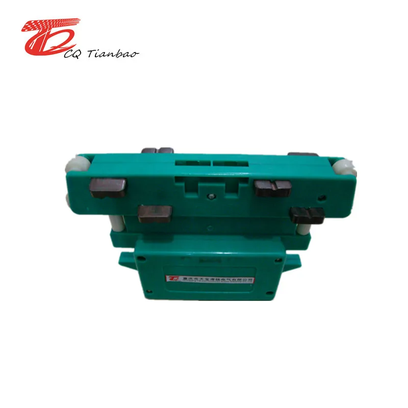 Insulated conductor rail system current collector for cranes
