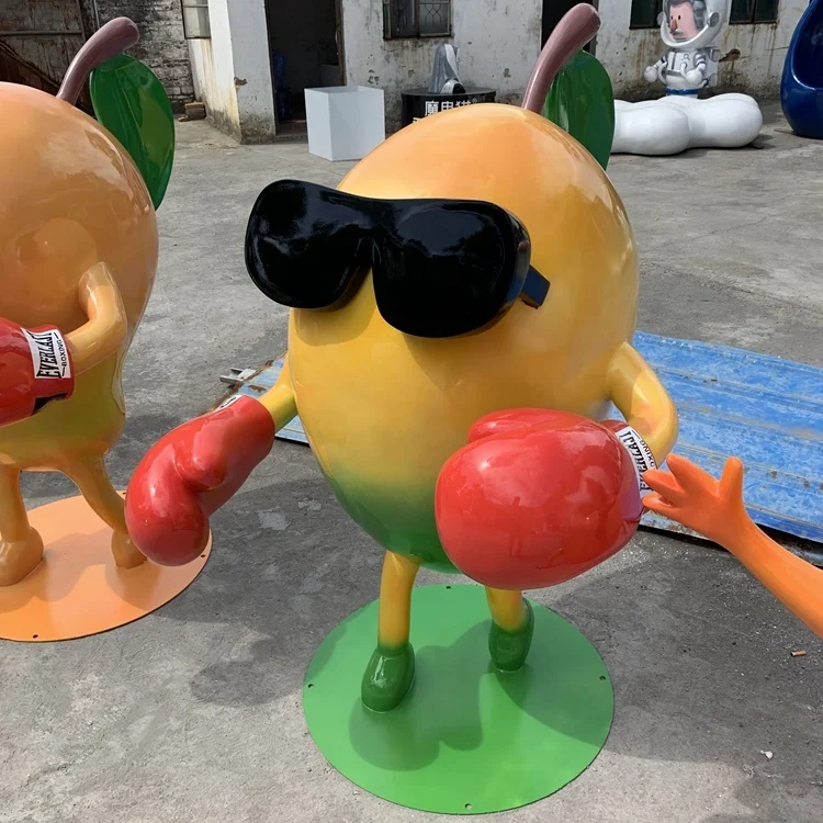 A cartoon sculpture of a glass fiber reinforced plastic mango Fruit model ornaments Outdoor cartoon  Resin fiber figuresculpture