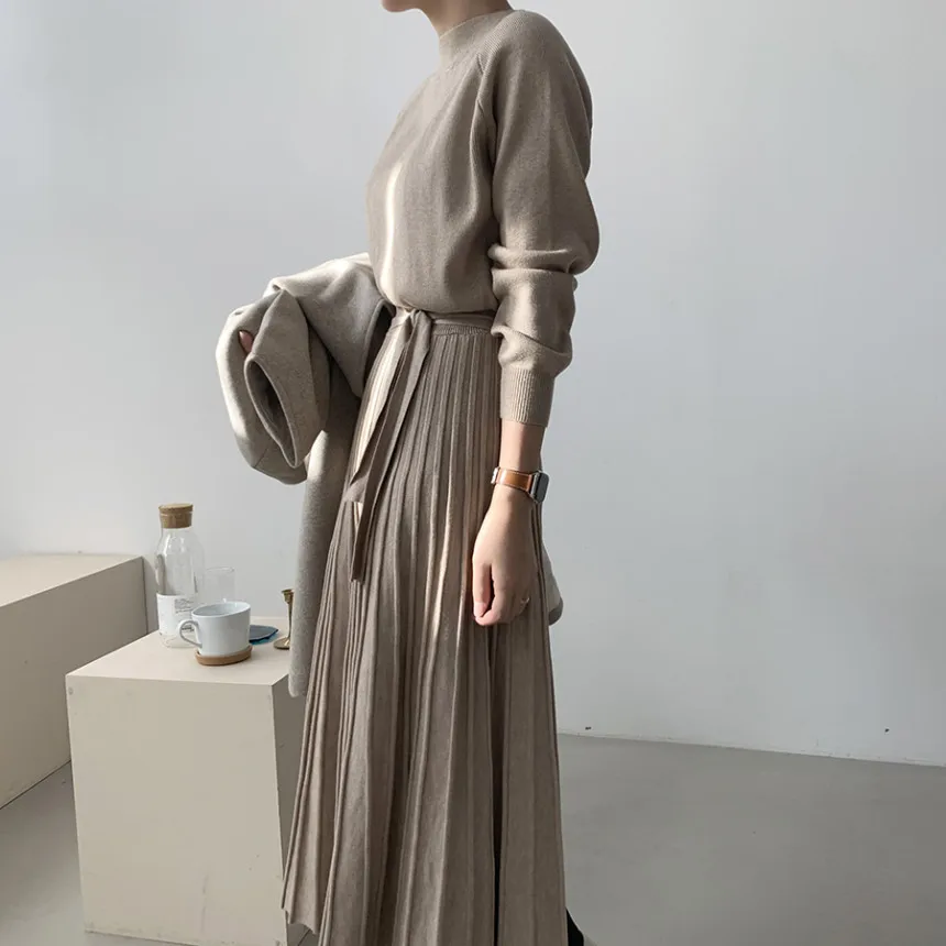 Korean version of autumn and winter new simple long thick knitted sweater solid color waist and thin with coat dress women