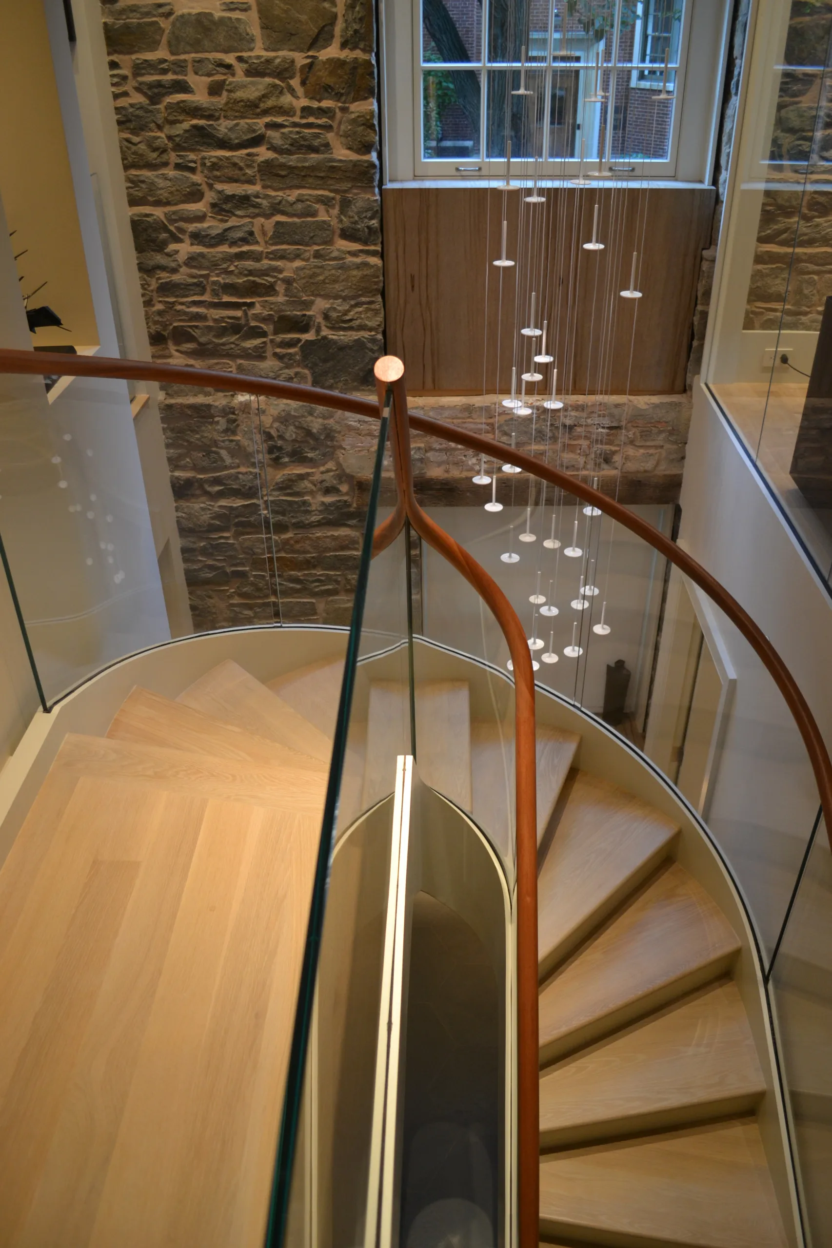 VIKO Stair The Inward-rolling Elegant White Hidden Stringer Curved Staircase Spiral Stair.