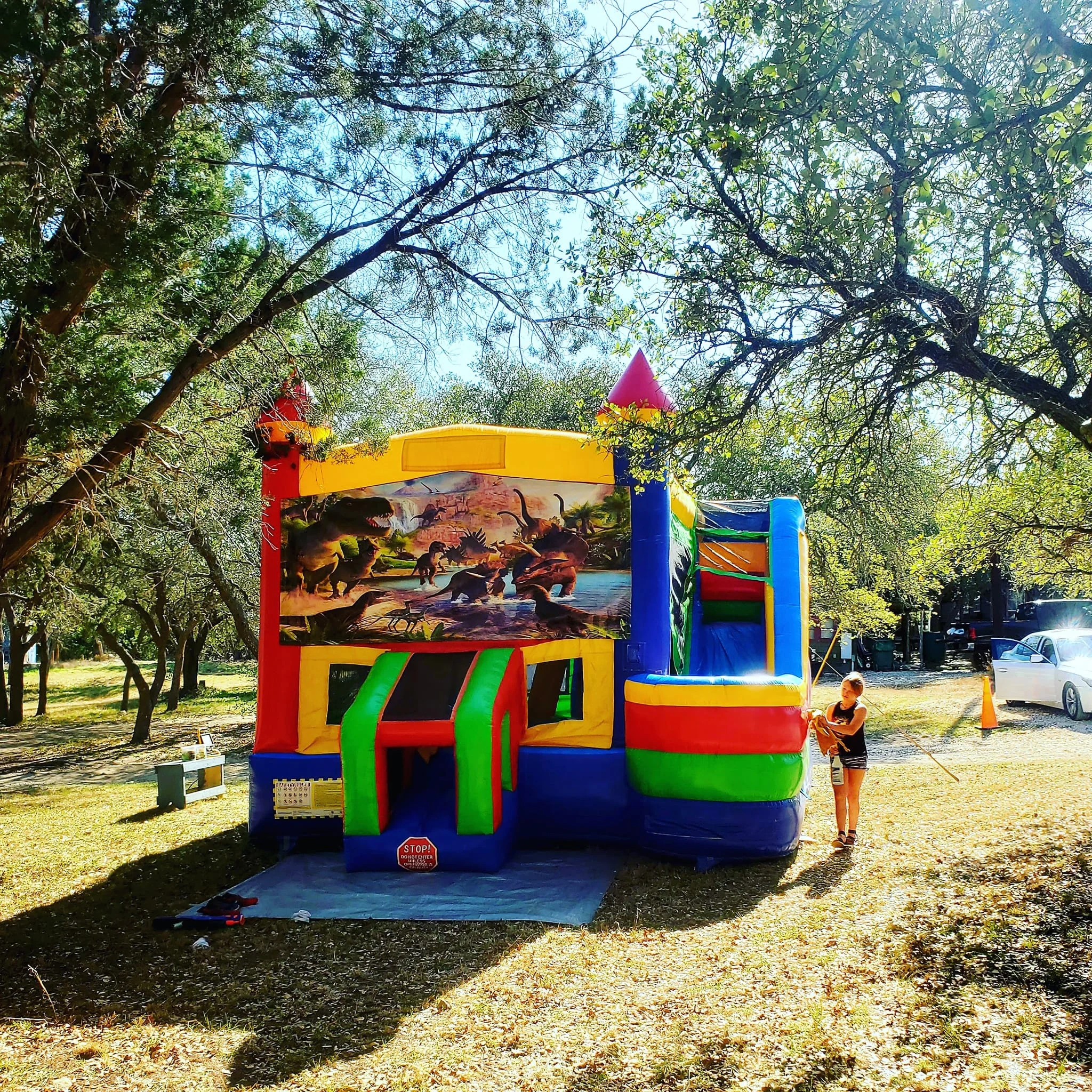 Commercial Jurassic Inflatable Dinosaurs Side Slide Combo Bouncer Slide Bounce House With Dry Wet Water Slide